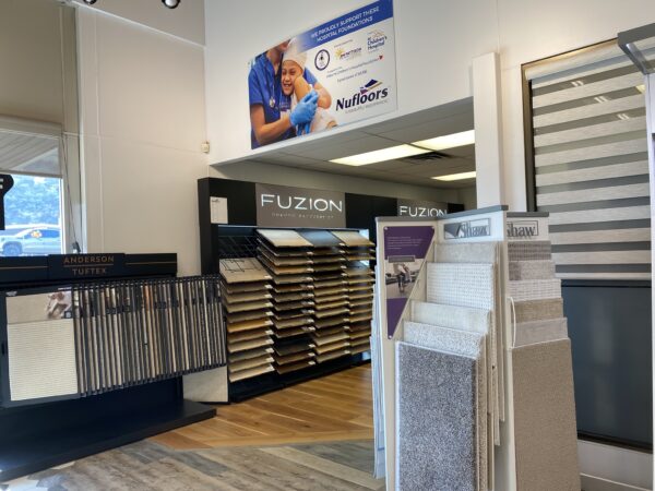 Flooring samples at Nufloors Kamloops, including samples from the brands Shaw, Anderson Tuftex, and Fuzion flooring