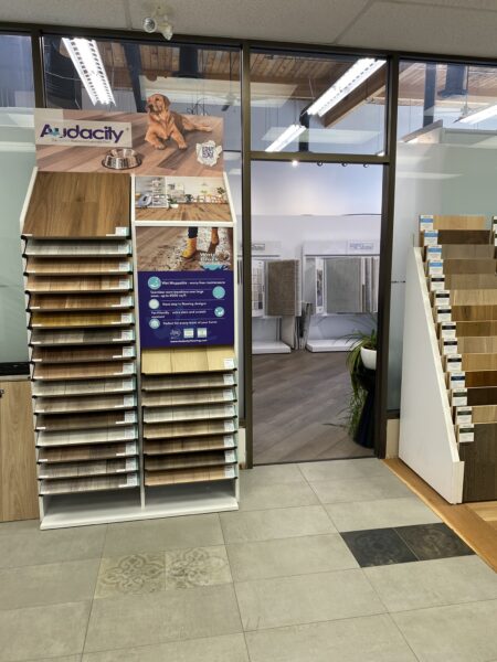 A display of waterproof flooring samples from Audacity Flooring