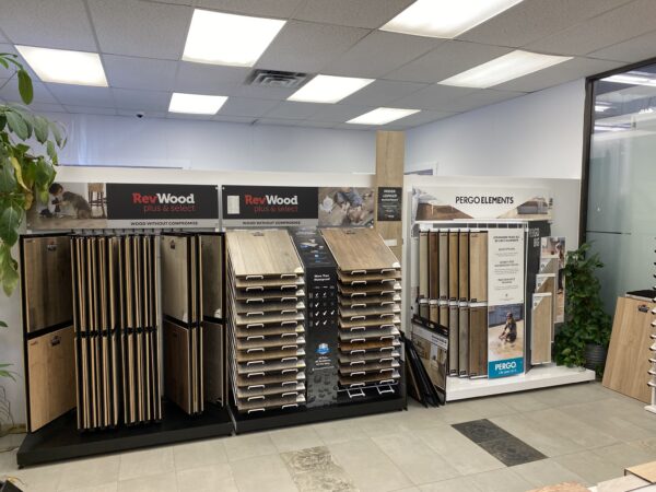 Samples from flooring brands RevWood and Pergo Elements waterproof wood in Nufloors Kamloops
