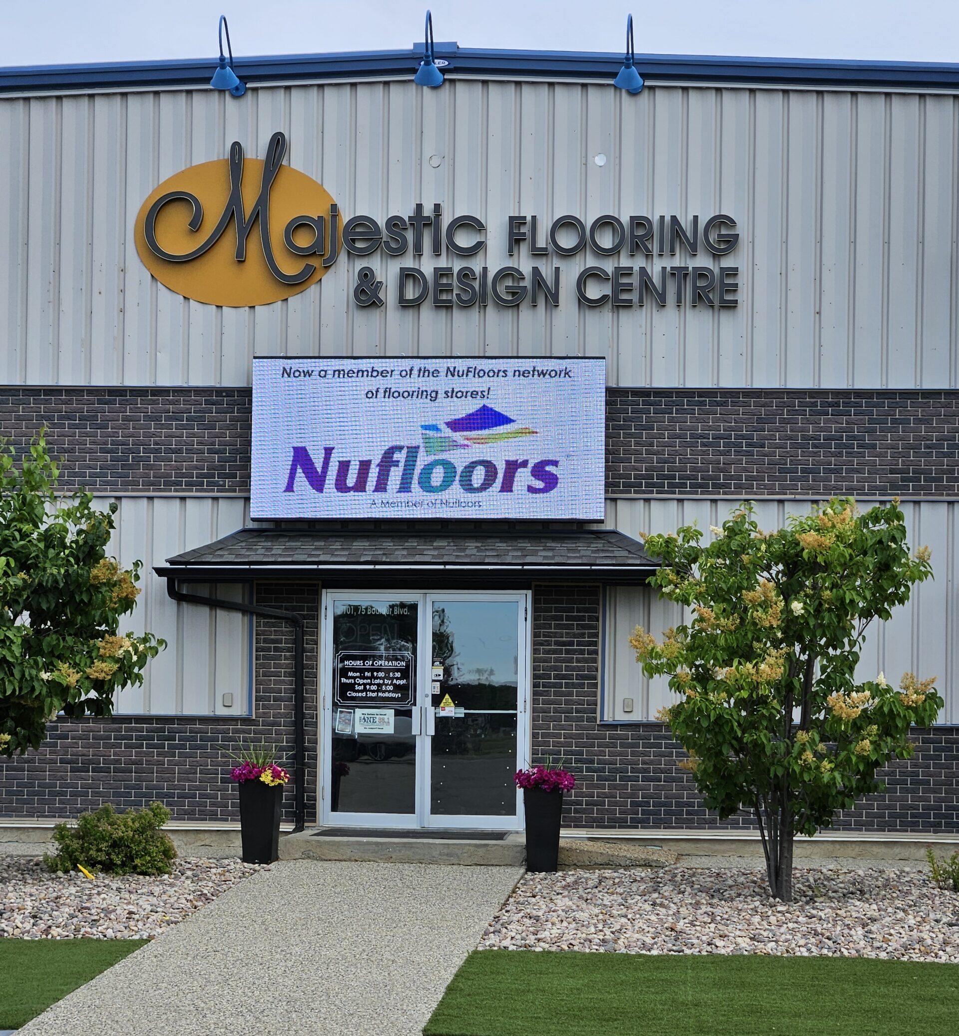 Majestic Flooring & Design Centre entrance with new Nufloors sign below the Majestic sign.