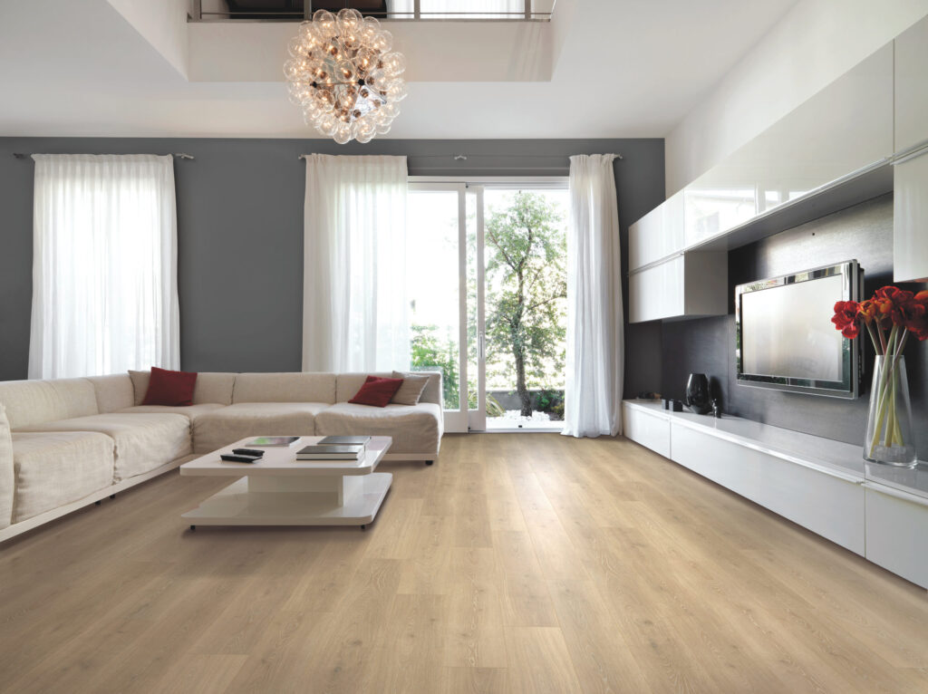 Wood textured floor in a room with a sofa, TV and a sliding door.