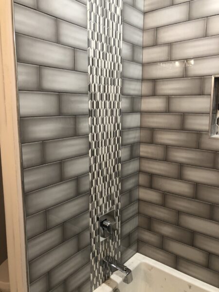 Dark Brown wall tiles in a bathroom.