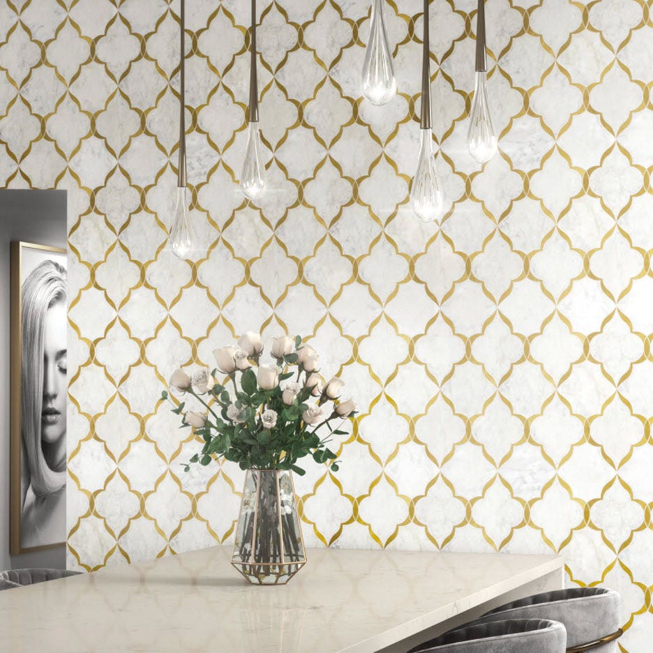 A luxury white kitchen with white and gold waterjet tiles