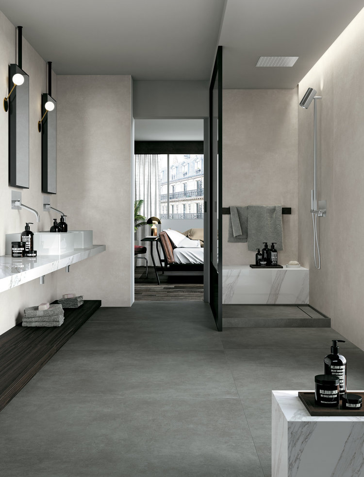 Large tiles in modern bathroom, used to make a small room look bigger