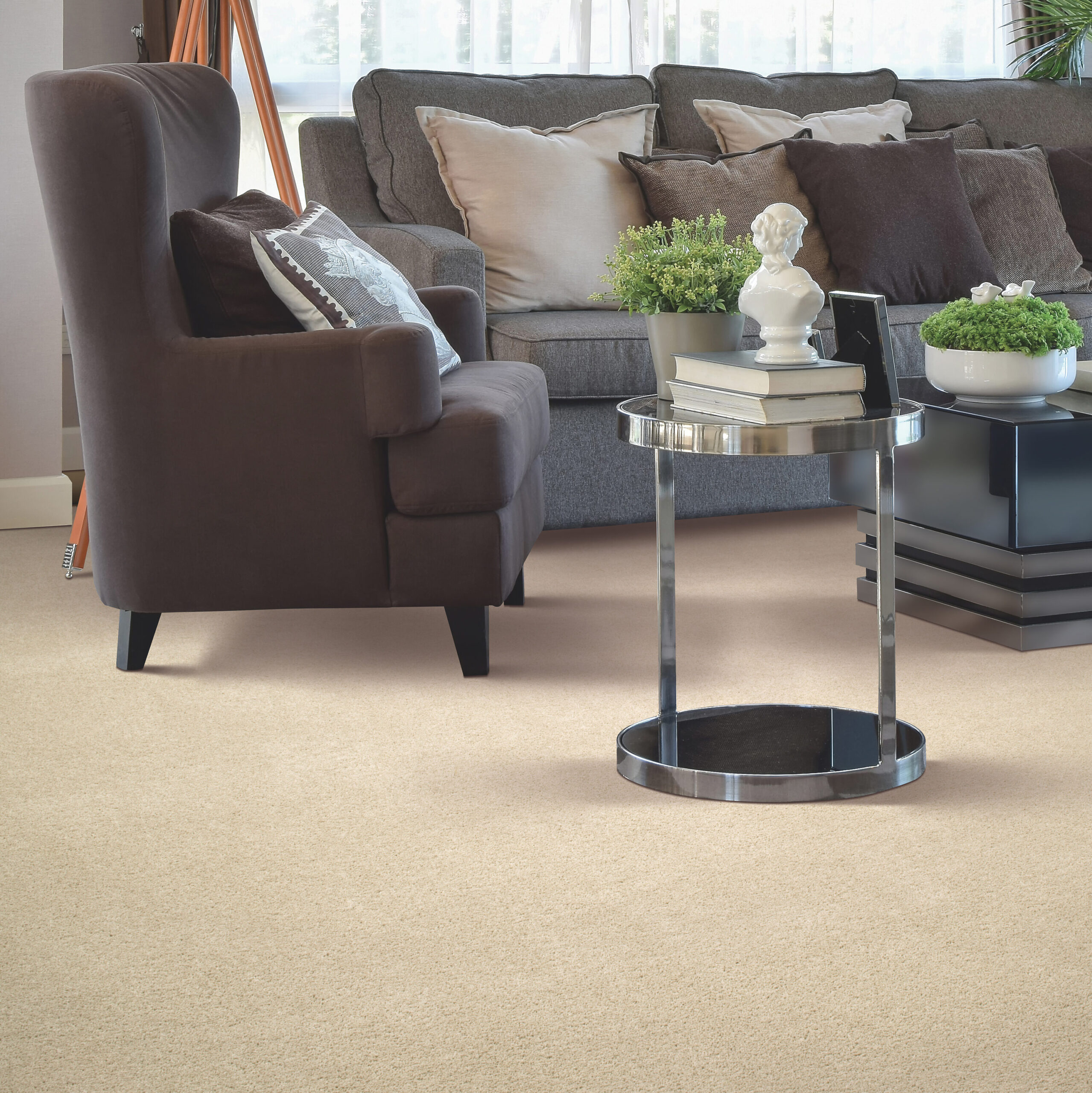 eco-friendly flooring by Mohawk carpet made from recycled bottles, shown in a cozy living room with dark seating and a dark metal coffee table.