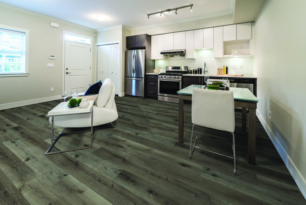 Luxury vinyl plank in a rental home kitchen and dining area