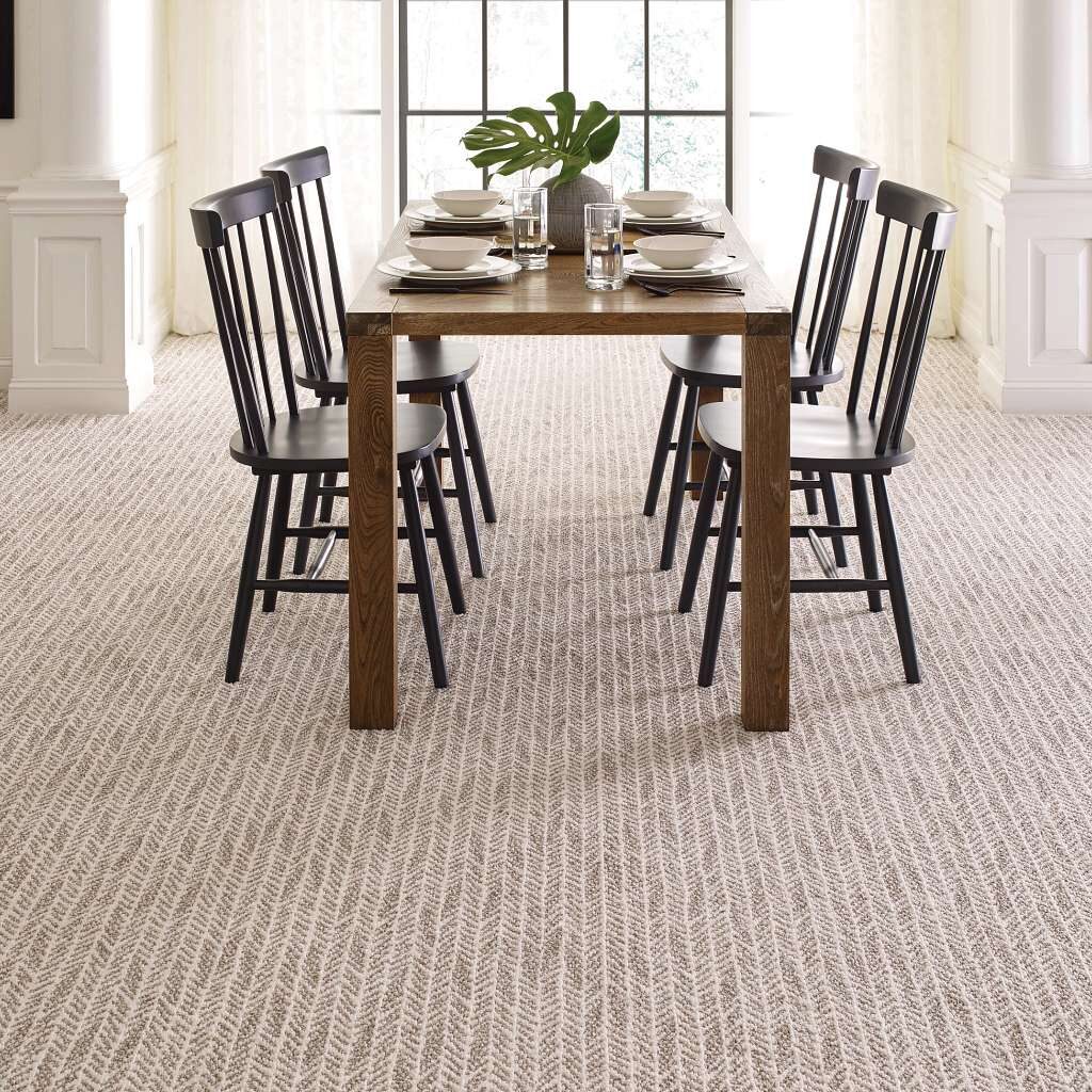Shaw Lead the Way warm beige striped carpeting in a dining room.