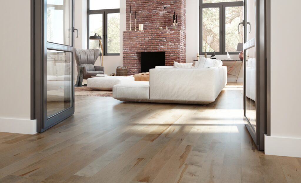 Mercier hard maple Hardwood flooring in the shade Treasure Design shown in a living area with french doors.