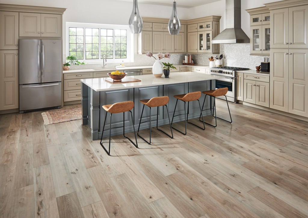 Mannington Laminate flooring's Restoration Collection Anthropology in the colour Parchment shown in a neutral kitchen.