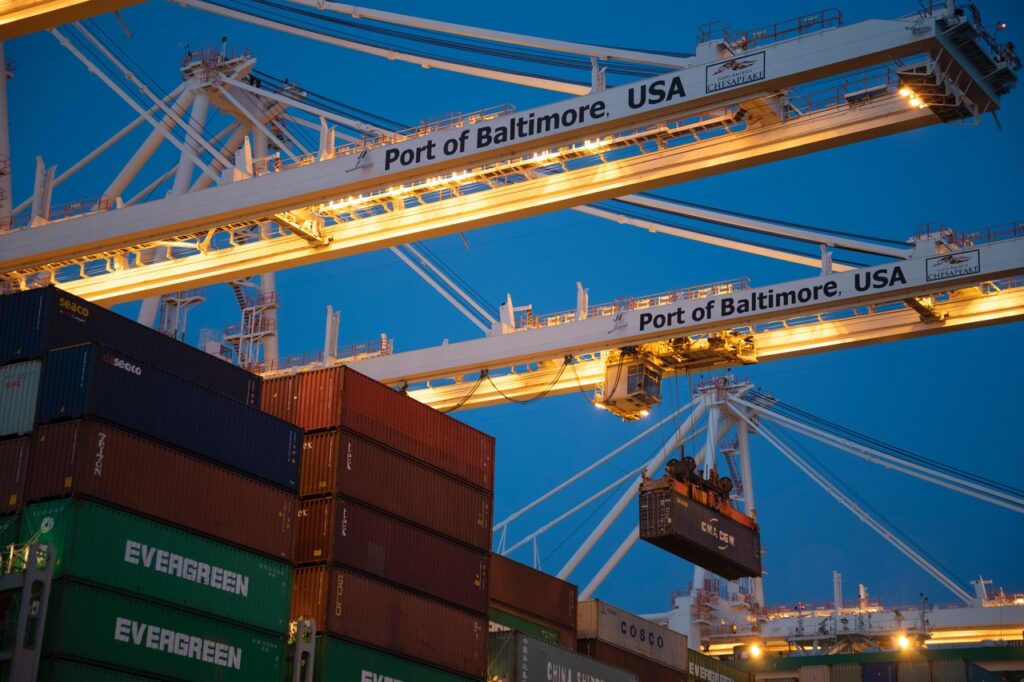 Shipping containers at the Port of Baltimore in the early evening, highlighting the shortages of shipping containers impacting the supply chain.
