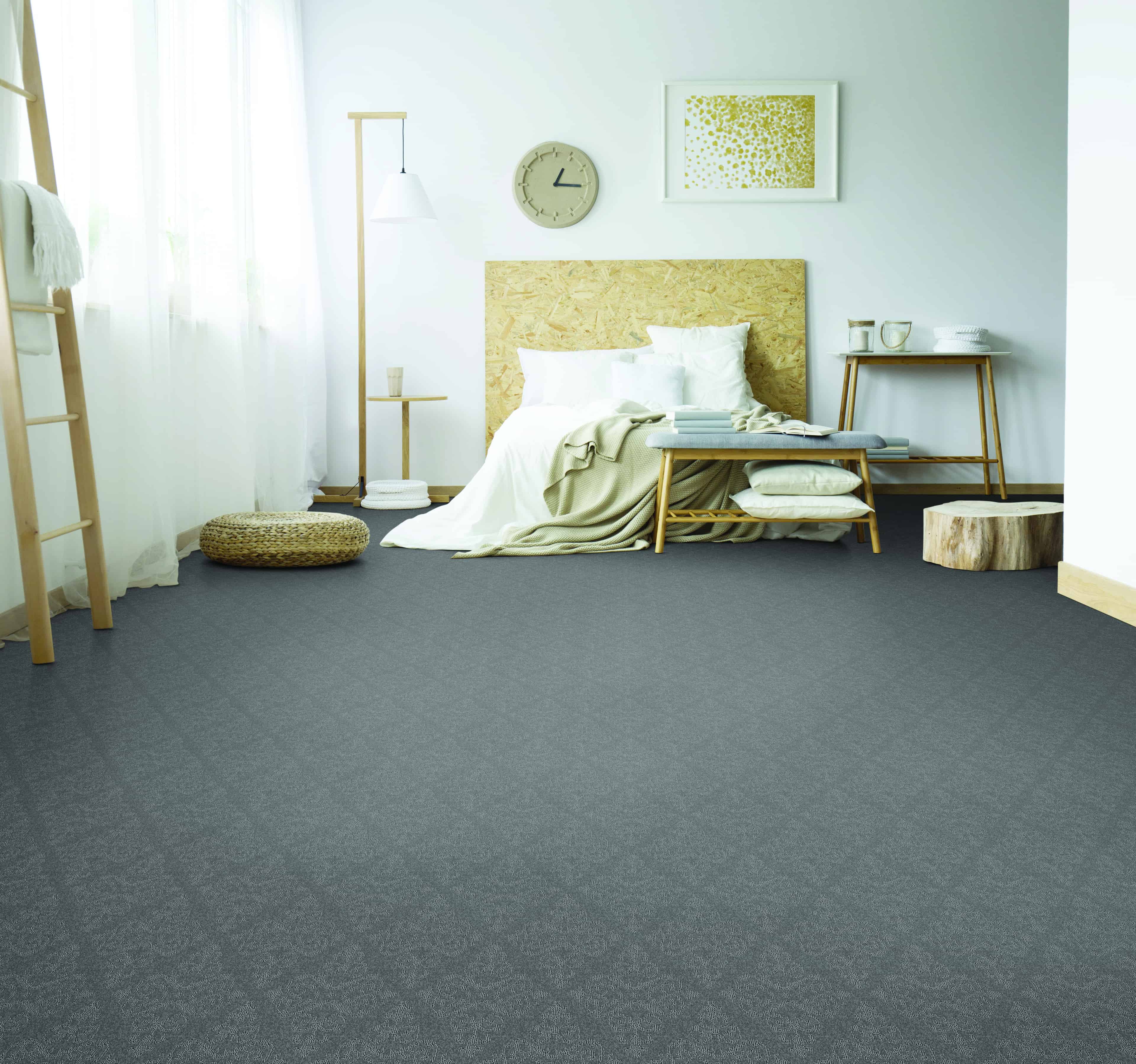 Medium grey Pet Protect Carpet by Husky Carpet in a bedroom with white walls and light wood furniture.
