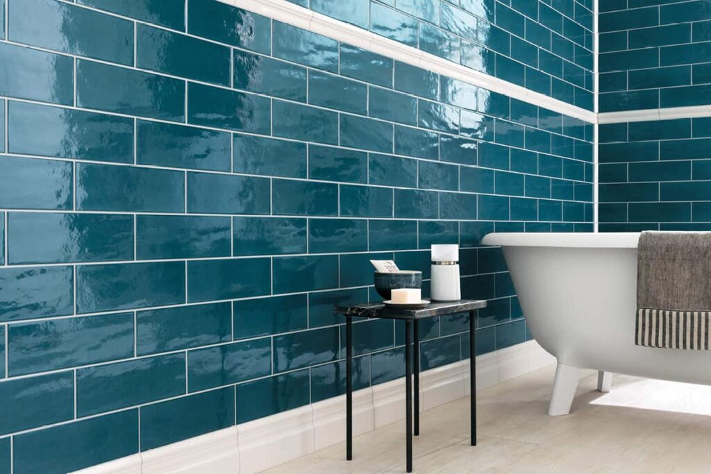 Blue rectangular wall tiles in a bathroom.