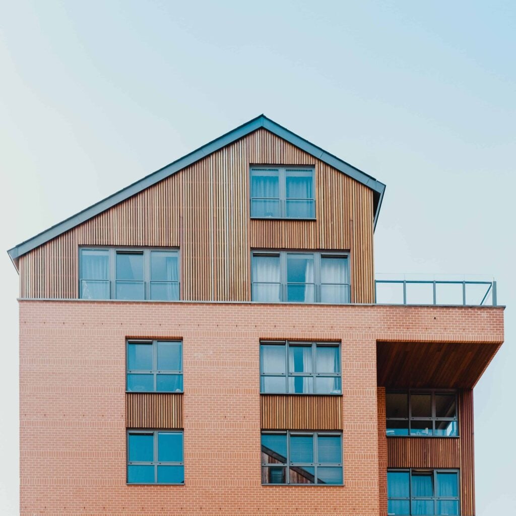Exterior of wood and brick home.