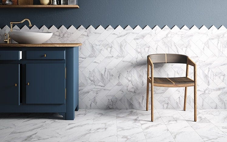 Ceramic tile in custom pattern behind bathroom sink