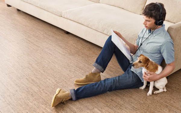 Man and Dog sitting on Cork Flooring