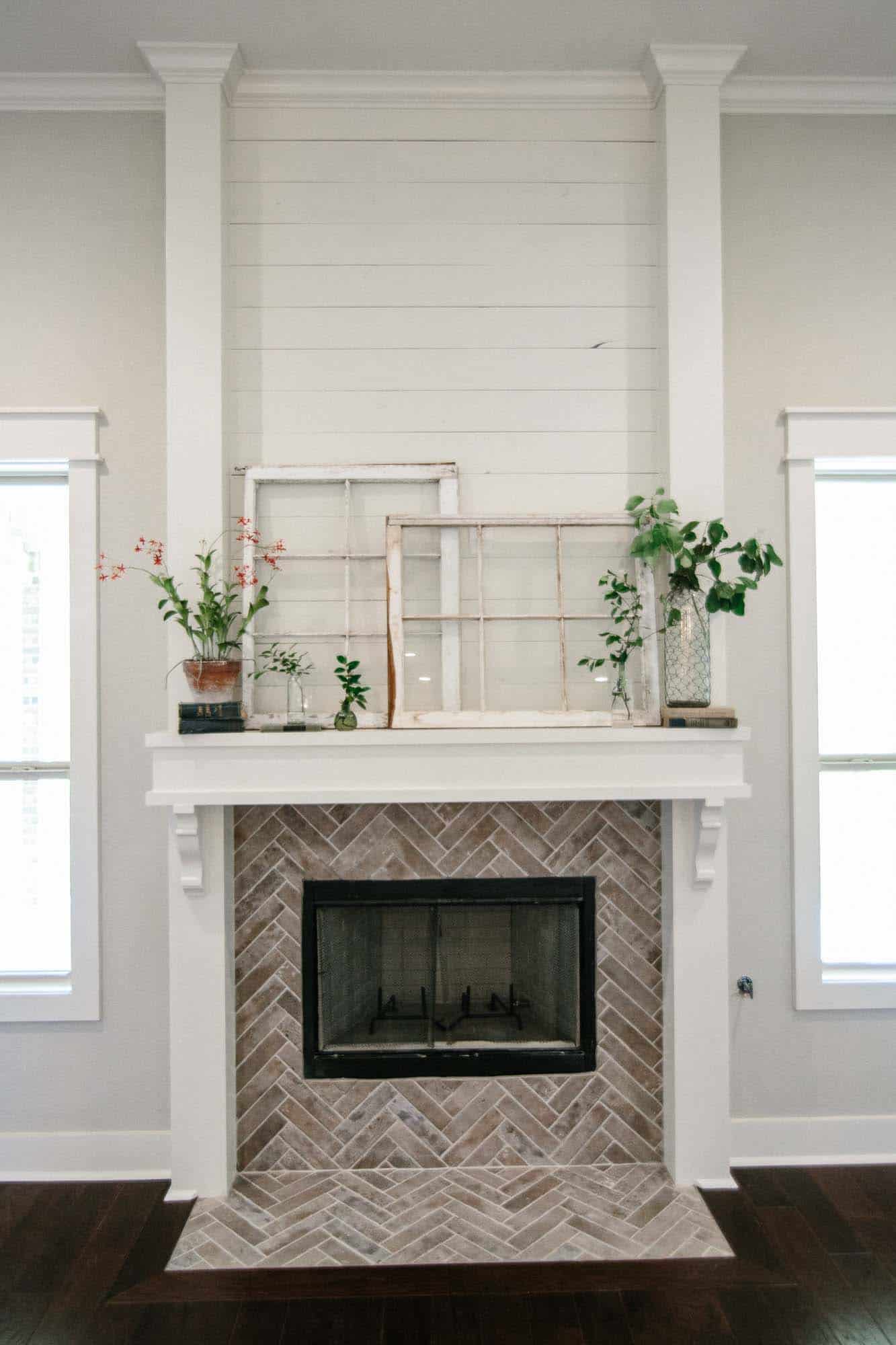 Farmhouse style fireplace with herringbone tiling