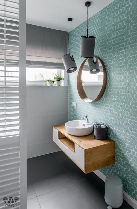 Green hexagonal tiles in bathroom.