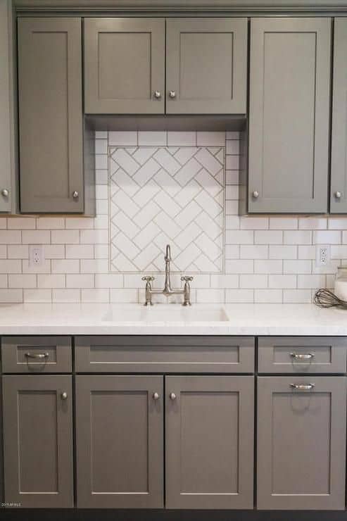 Herringbone tile emphasized by grey grout