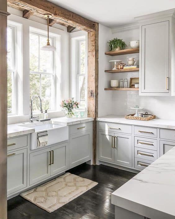 A kitchen with white cabinets.