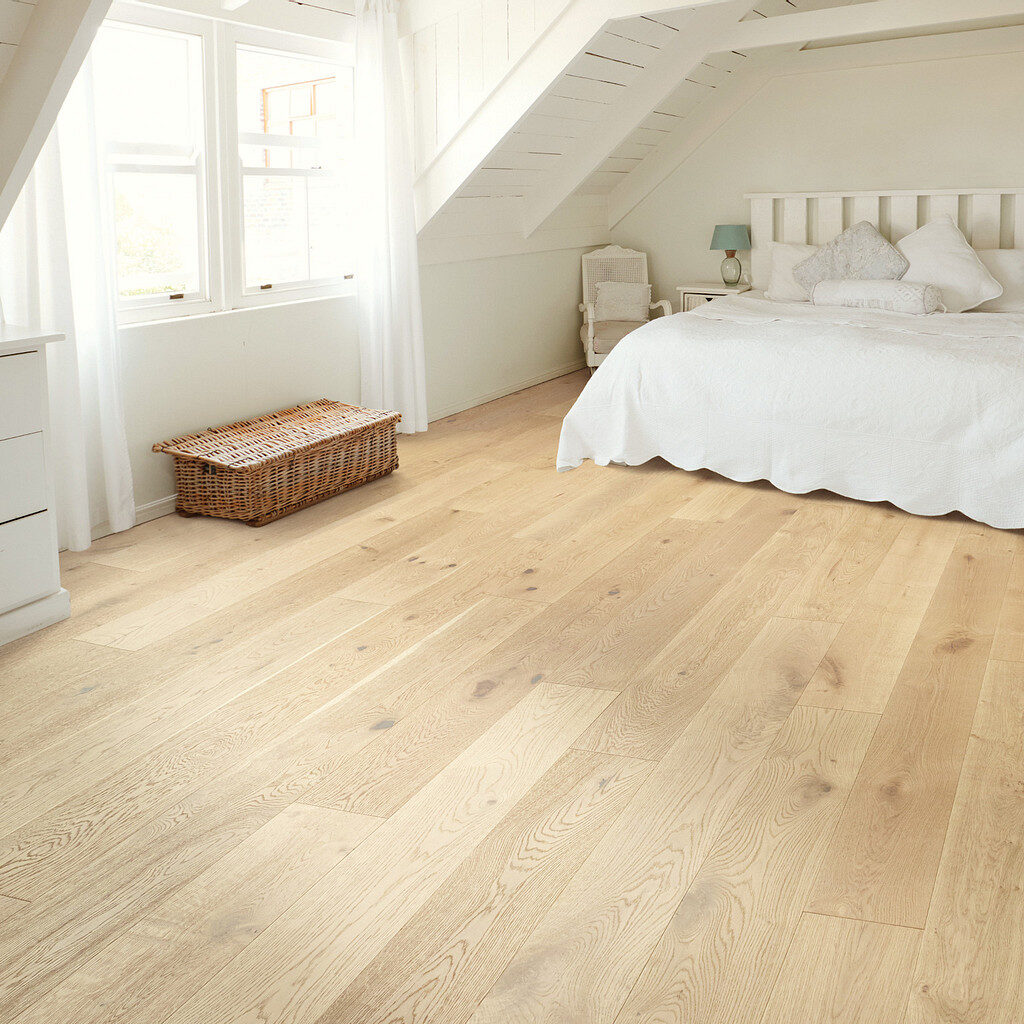 Bright bedroom with light oak hardwood flooring