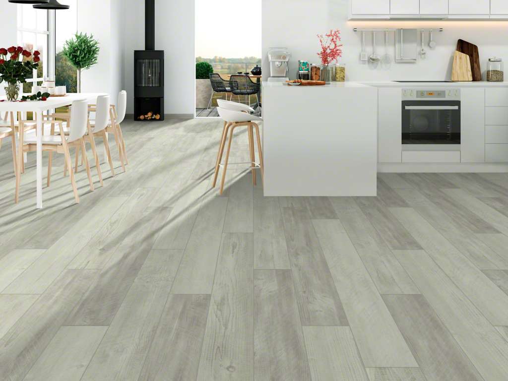 A wood textured floor in an open concept kitchen.