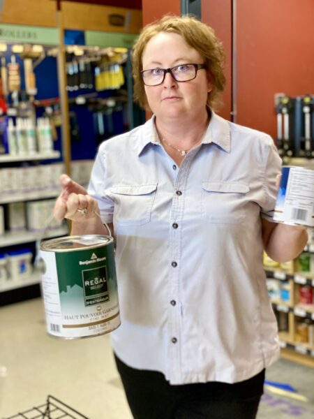 Nufloors Slave Lake Team Member Holding Paint Cans