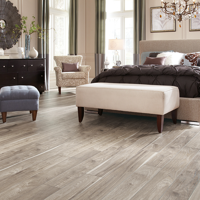 Handscraped wood flooring in bedroom by Mannington Floors and offered by Nufloors