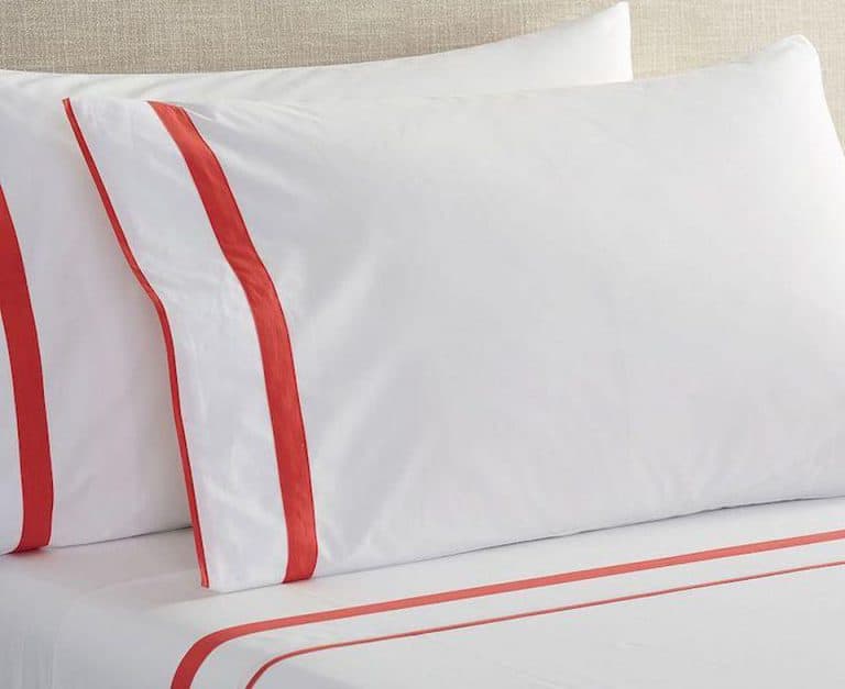 White pillows with red stripes.